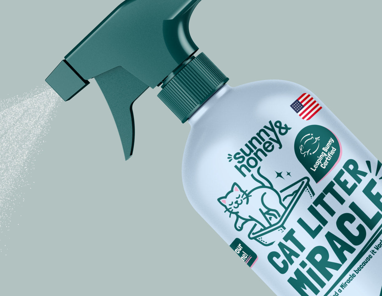 Sunny & Honey Cat Litter Miracle product being sprayed with a green spray bottle on a light gray background.