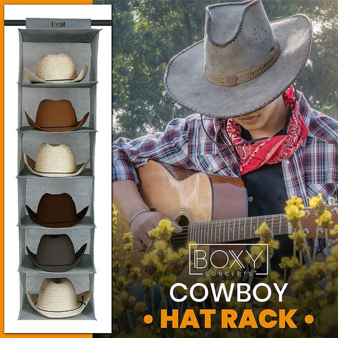Boxy Concepts' cowboy hat rack with hats on shelves and a person playing guitar outdoors.