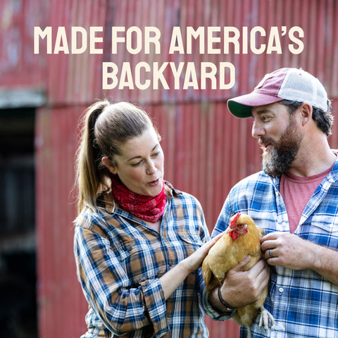 Couple holding a chicken.